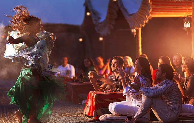 group of people watching bellydancer