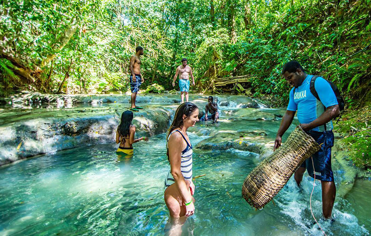 group of people playing in water